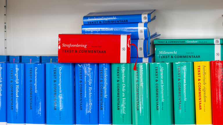 A bookcase full of law books. Also the Code of Criminal Procedure.